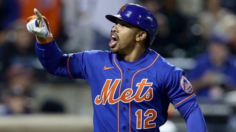 Francisco Lindor of the Mets reacts after his fourth-inning home run...