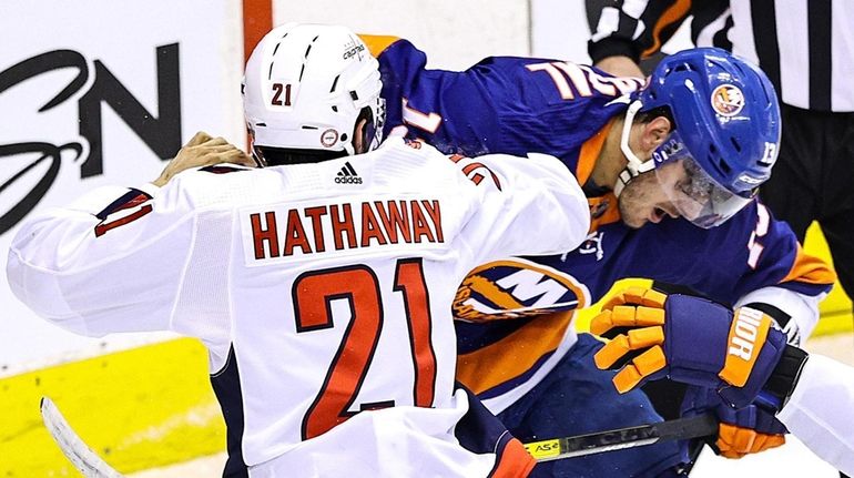 Garnet Hathaway of the Capitals drops the gloves against Mathew Barzal of...