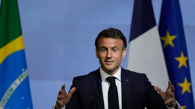 French President Emmanuel Macron speaks during a meeting with the...