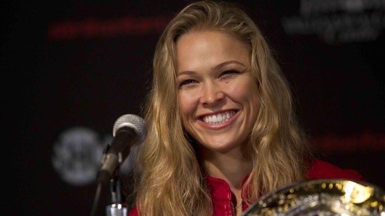 Strikeforce women's bantamweight champion Ronda Rousey speaks at a press...