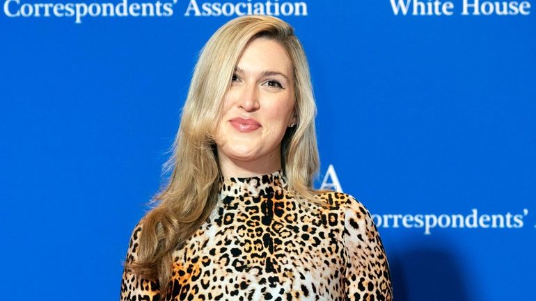 New York magazine’s Washington correspondent Olivia Nuzzi poses for photographers...