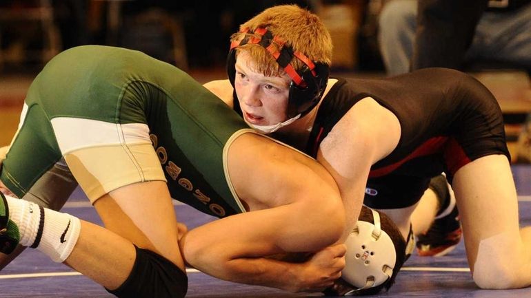 Connetquot's Sean McCabe, right, defeated Longwood's Cory Rasheed, 5-3, in...