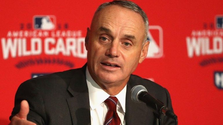 Major League Baseball Commissioner Rob Manfred addresses the media during...