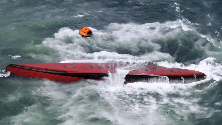 A South Korean tanker is seen capsized off Mutsure Island,...