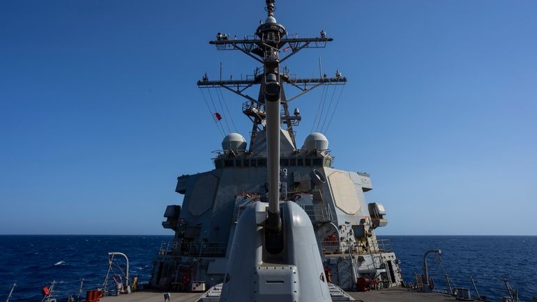 The Arleigh Burke-class guided missile destroyer USS Laboon sails in...