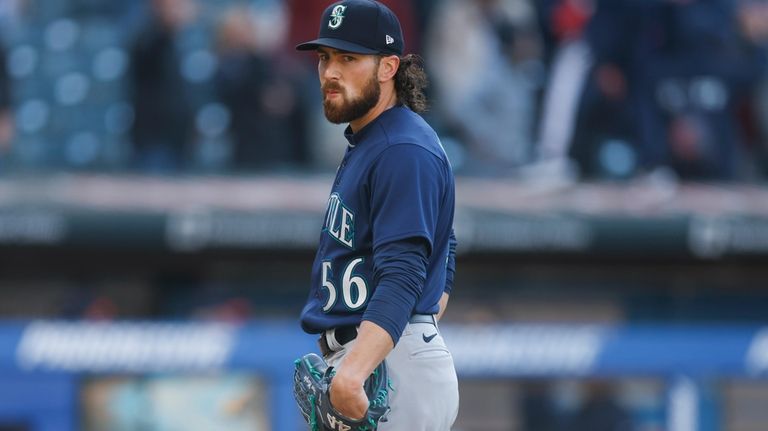 Seattle Mariners' Teoscar Hernandez hits an RBI single off Cleveland  Guardians relief pitcher Nick Sandlin during the 12th inning of a baseball  game, Sunday, April 9, 2023, in Cleveland. (AP Photo/Ron Schwane