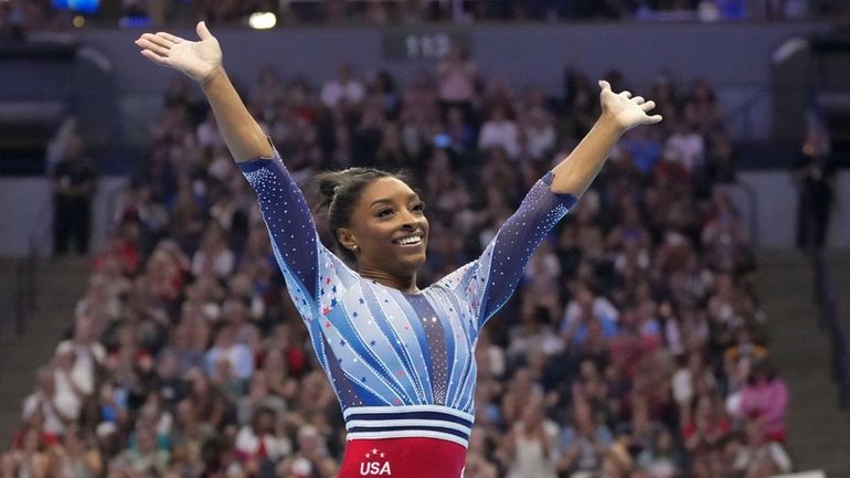 Simone Biles smiles after the floor exercise at the United...