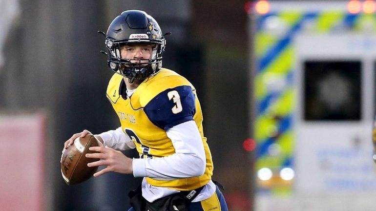 Shoreham-Wading River QB Dylan Zahn looks downfield for an open...