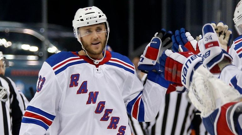 Fredrik Claesson #33 of the Rangers celebrates his first period...