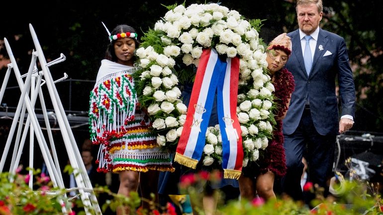 Dutch King Willem-Alexander lays a wreath at the slavery monument...