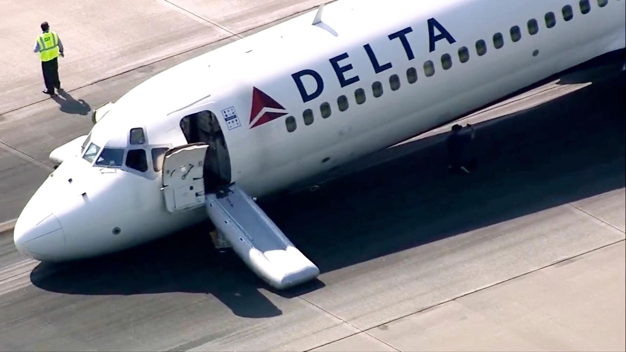 Delta Passengers Exit Flight Using Jet Slide After Plane Lands Without ...