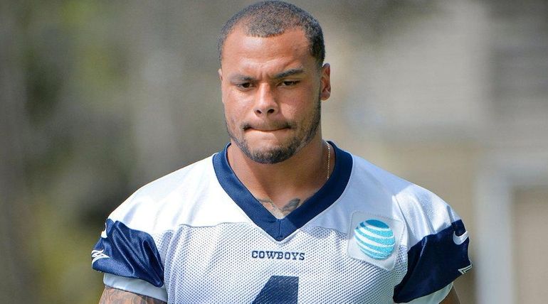 Dallas Cowboys quarterback Dak Prescott takes the field for a...