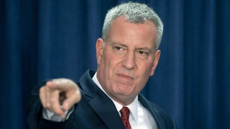 New York City Mayor Bill de Blasio takes a question...