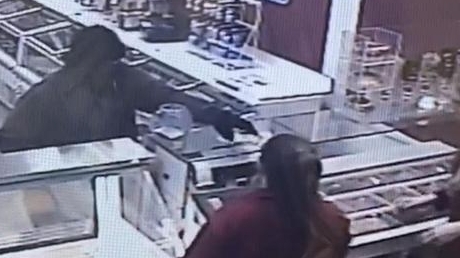 Surveillance video shows robbery with machete - Newsday