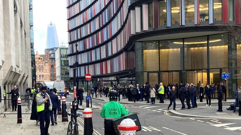 People outside the Old Bailey after it was evacuated due...