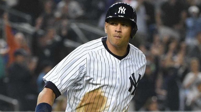 New York Yankees designated hitter Alex Rodriguez runs on his...