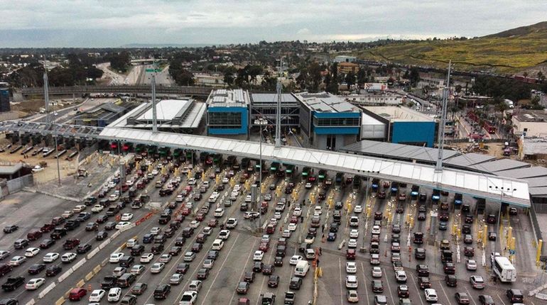 Vehicles at the San Ysidro crossing port on Thursday wait...