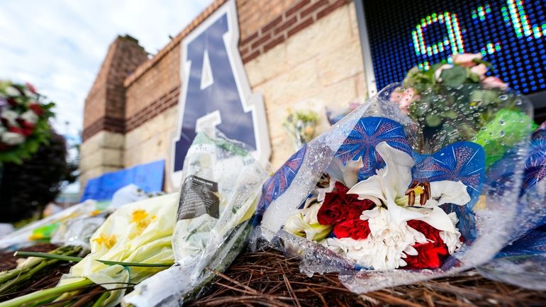 A memorial is seen at Apalachee High School after the...