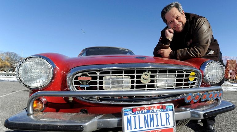 Irv Gordon, of East Patchogue, with his 1966 Volvo P1800 in...