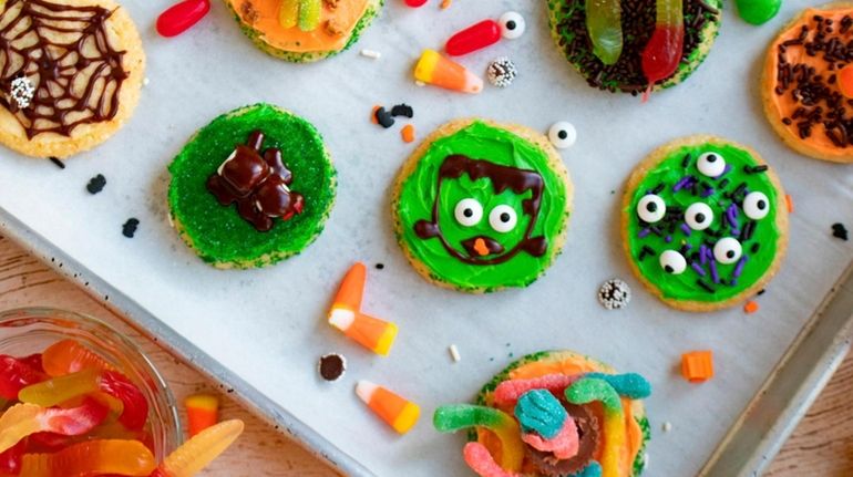 Slice-and-bake cookies topped with frosting and candy for Halloween.