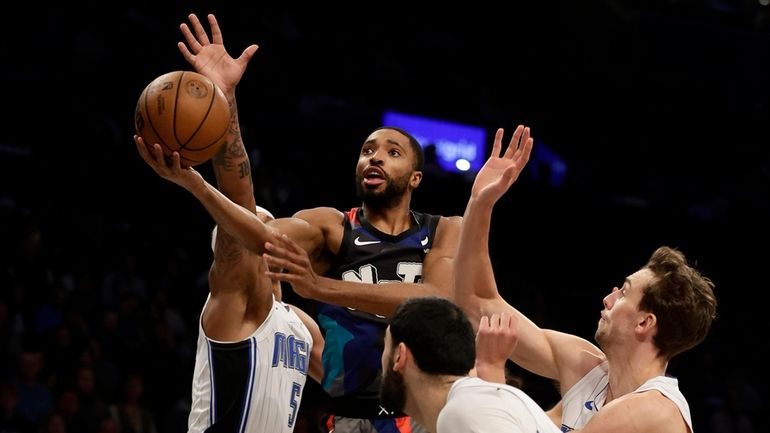 Mikal Bridges #1 of the Nets goes to the hoop...