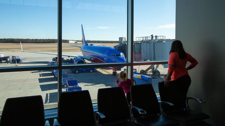 A Southwest plane prepares for departure at Long Island MacArthur...