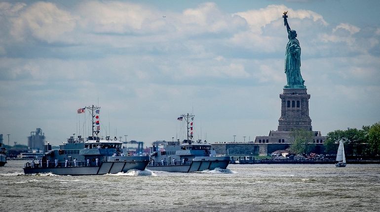 Fleet Week ships parade in New York Harbor on May 23,...