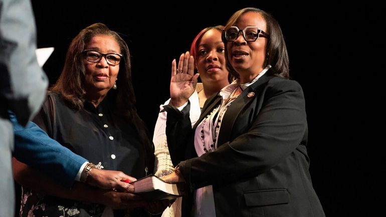 Former 6th District City Councilwoman Sharon Tucker is sworn in...