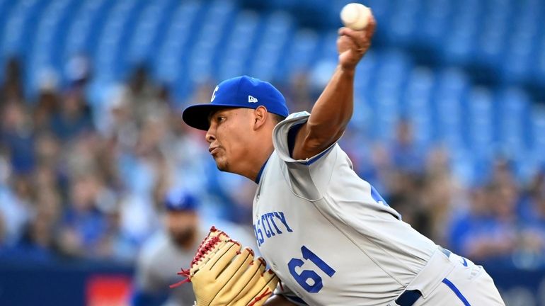 Kansas City Royals starting pitcher Angel Zerpa throws to a...