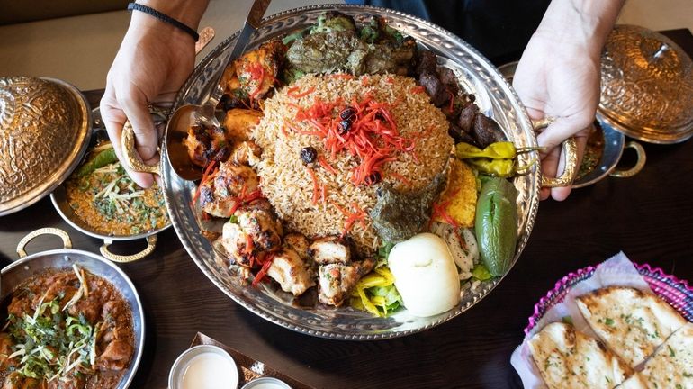 A mixed rotisserie platter at Zaoq 100 in Hicksville.