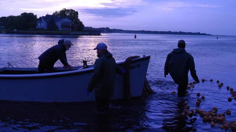 Tom Gariepy, Lenny Nilson and Kenny Anderson fish for bunker...