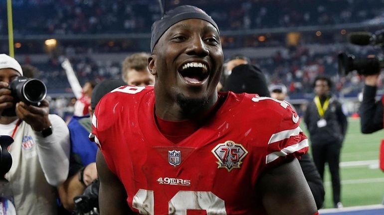 ]49ers wide receiver Deebo Samuel celebrates after the 49ers defeated...