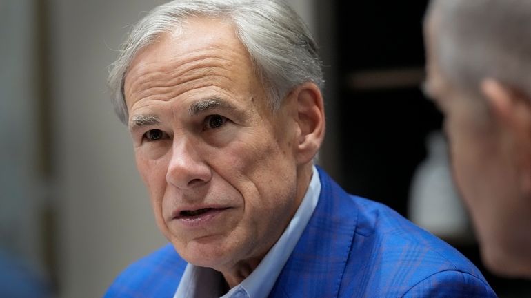 Gov. Greg Abbott receives a briefing for Hurricane Beryl from...