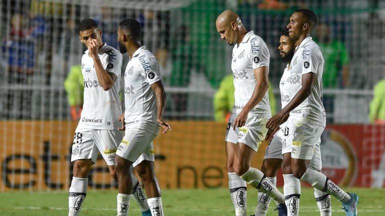 Players of Brazil's Santos leave the field at halftime of...