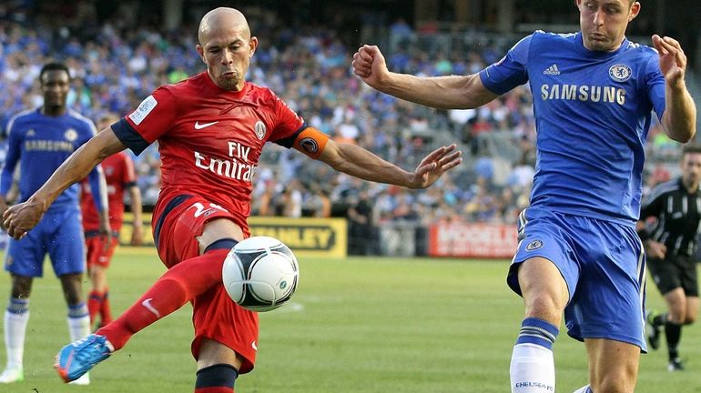 Paris St. Germain's Christophe Jallet fires at the goal in...