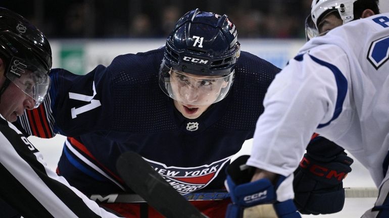 Rangers center Tyler Pitlick sets before a face off against...