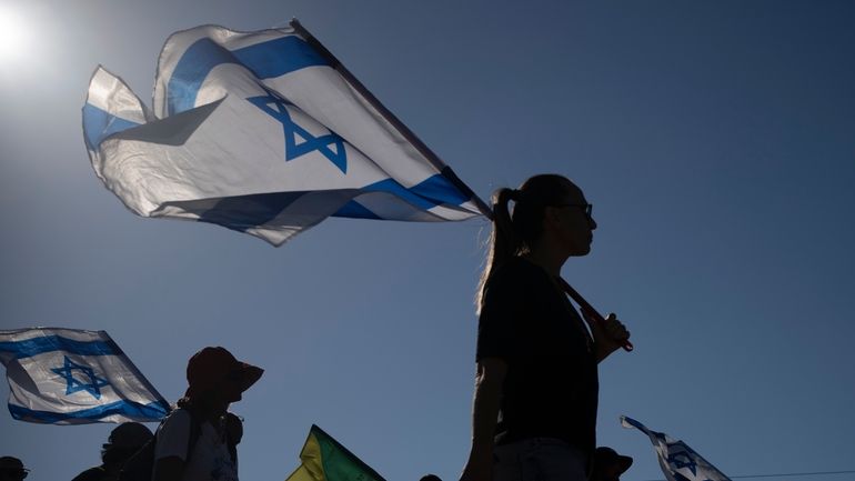 Relatives and friends of Israeli soldiers who were killed and...