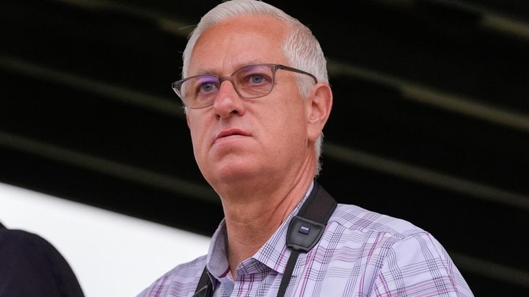 Trainer Todd Pletcher watches Belmont Stakes entrant Mindframe work out...