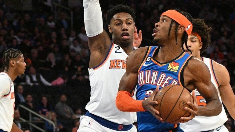 Thunder guard Shai Gilgeous-Alexander drives to the basket against Knicks guard...