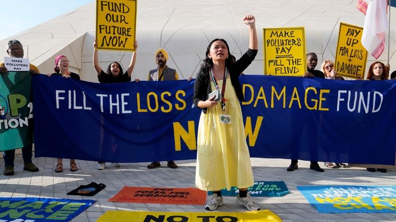 Activists participate in a demonstration for loss and damage at...