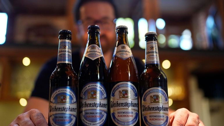 Head Brewmaster Tobias Zollo poses behind non alcoholic beer at...