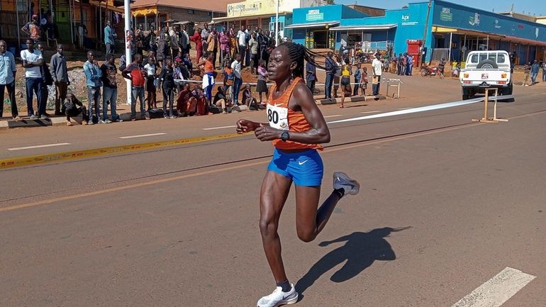 Rebecca Cheptegei, competes at the Discovery 10km road race in...