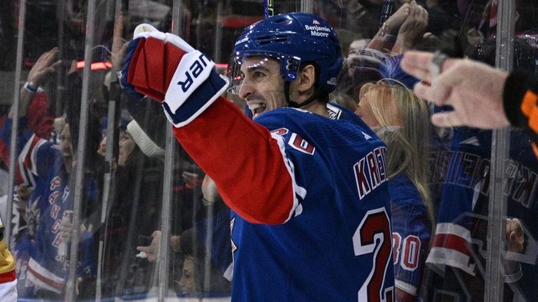 Rangers left wing Chris Kreider reacts after scoring as Golden...