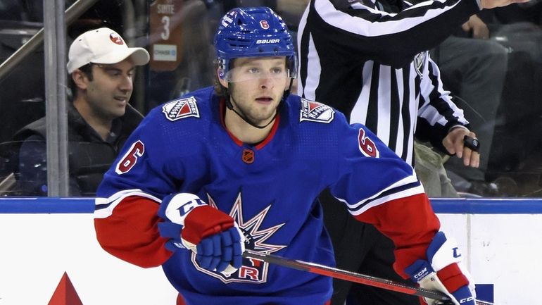 Zac Jones #6 of the New York Rangers skates against...