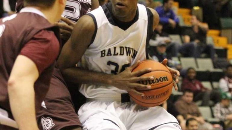 Baldwin's Kirk Staine is defended by opponent Christian White of...