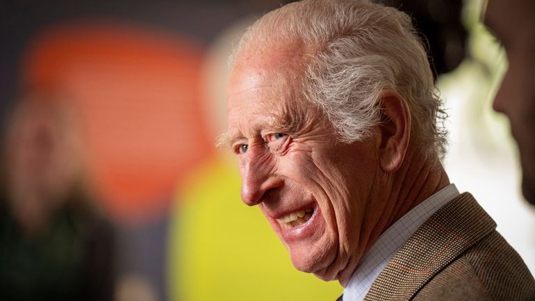 Britain's King Charles III smiles during his visit to the...