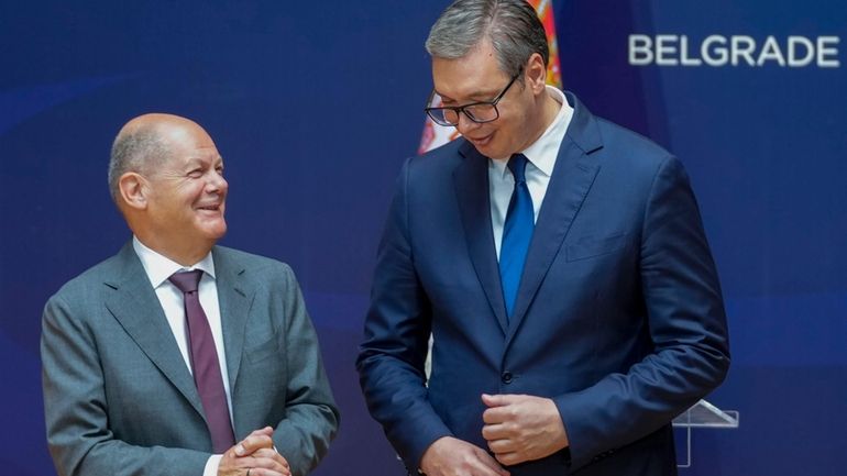 German Chancellor Olaf Scholz, left, and Serbian President Aleksandar Vucic...