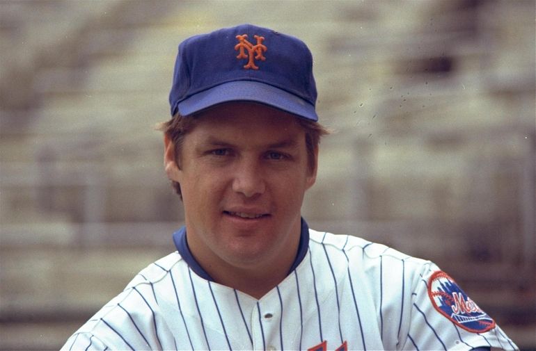 Former New York Met Tom Seaver throws the final pitch during the closing  ceremony of Shea Stadium following the Mets final regular season game  against the Florida Marlins on September 28, 2008