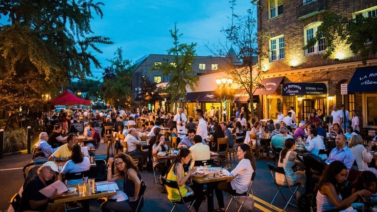 Dine in the street European-style on Summer Promenade Nights in...