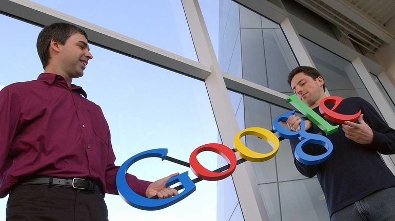 Google co-founders Larry Page, left, and Sergey Brin at company...